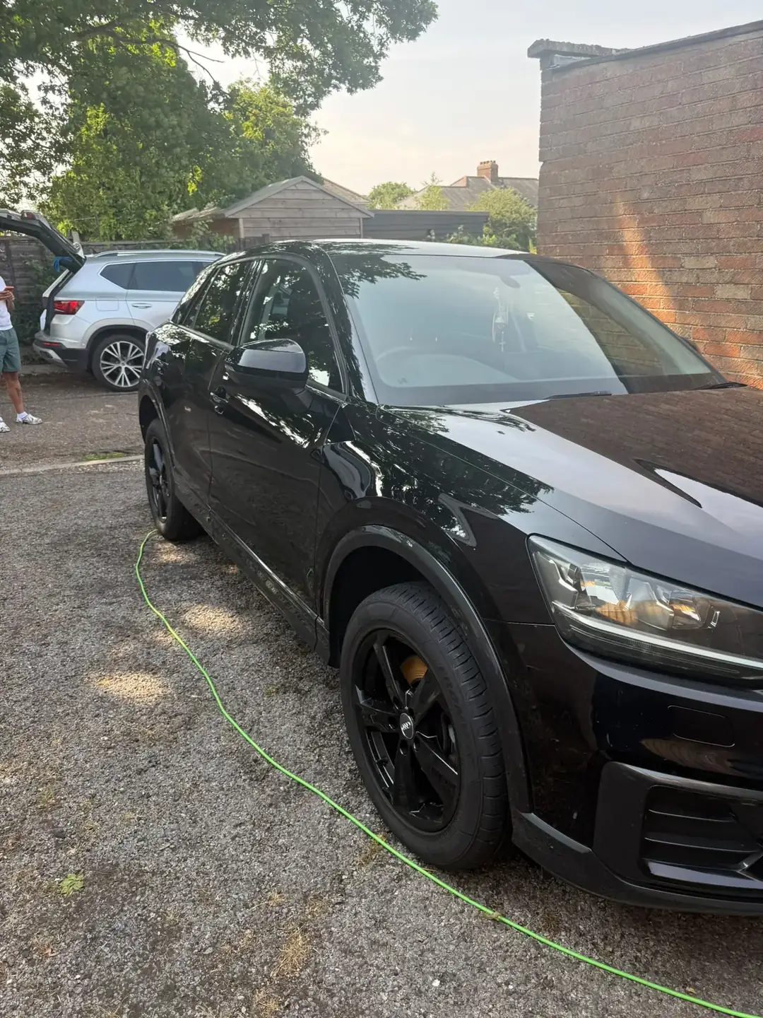 Audi Q2 front in evening light, gloss paintwork with sharp reflections
