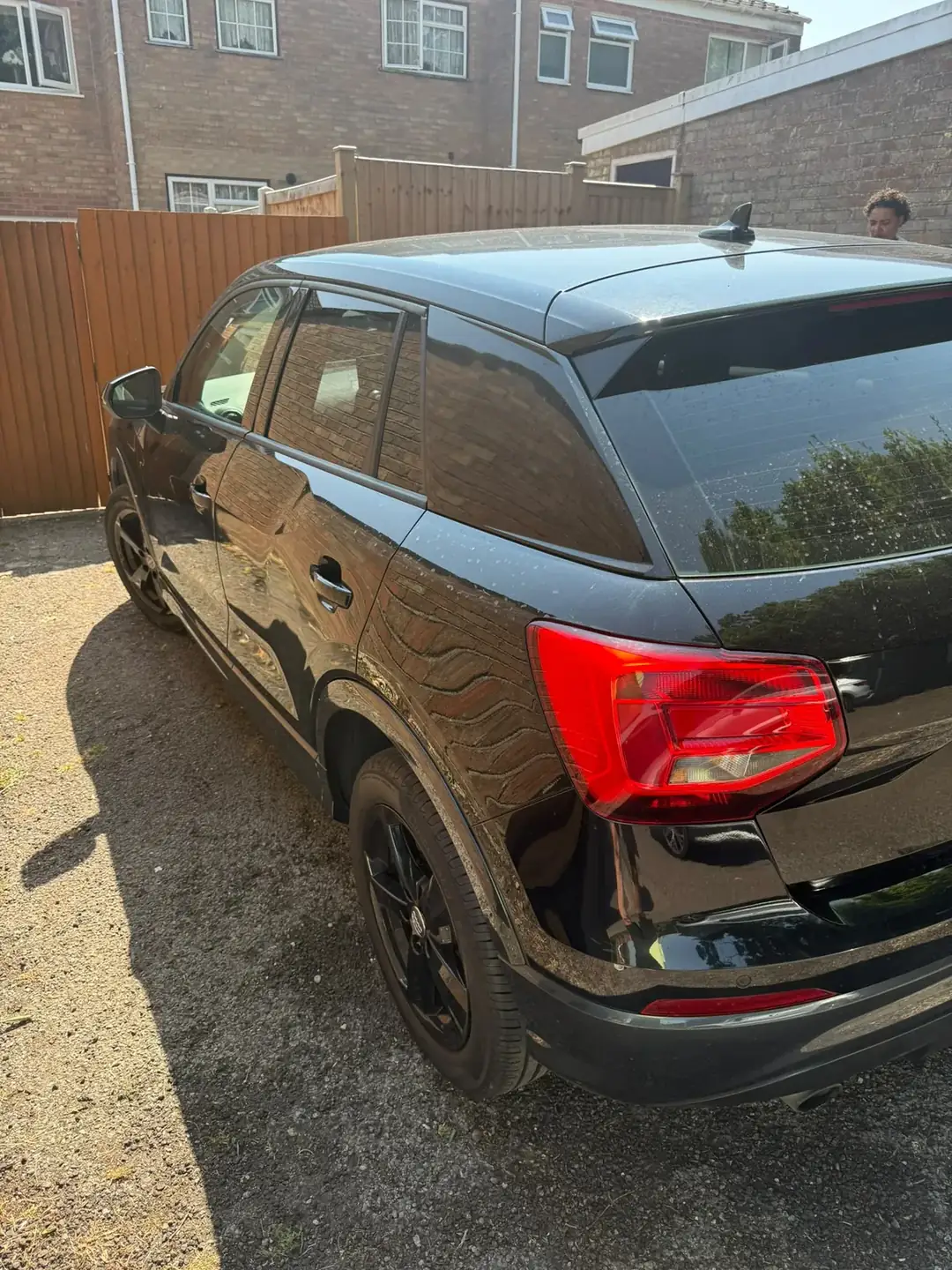 Audi Q2 rear three quarter on gravel drive after the detail