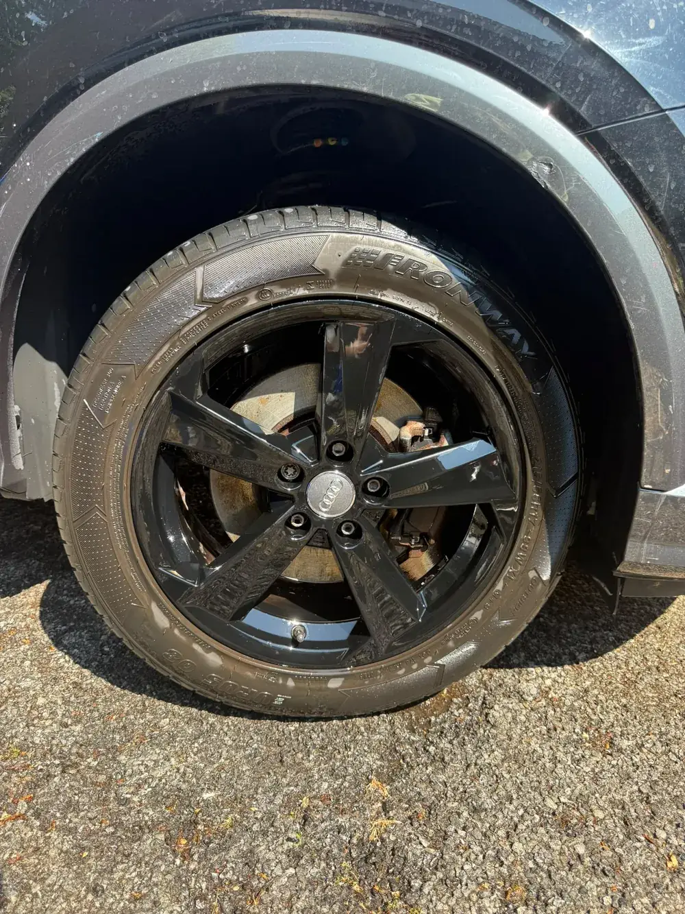 The same wheel mid clean, wet with cleaning products working